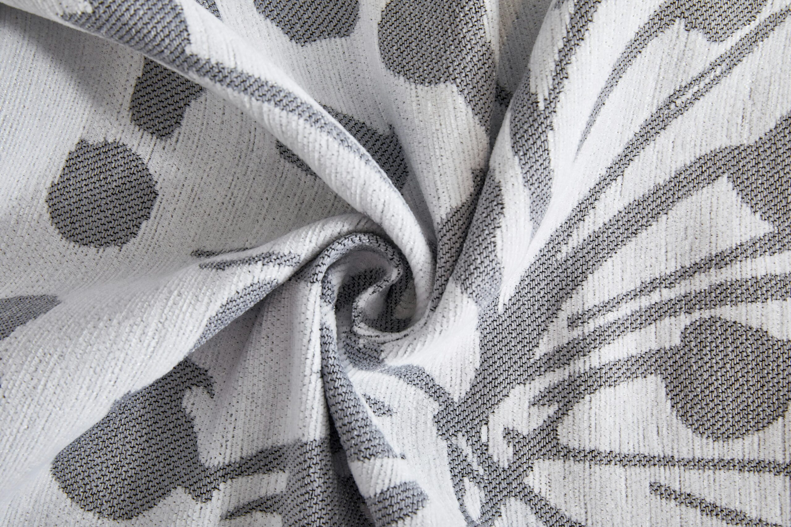 Close-up of a textured grey and white patterned fabric, ideal for home decor inspiration.